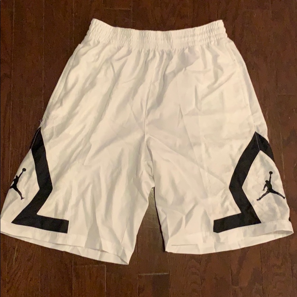 All white XL Jordan basketball shorts.